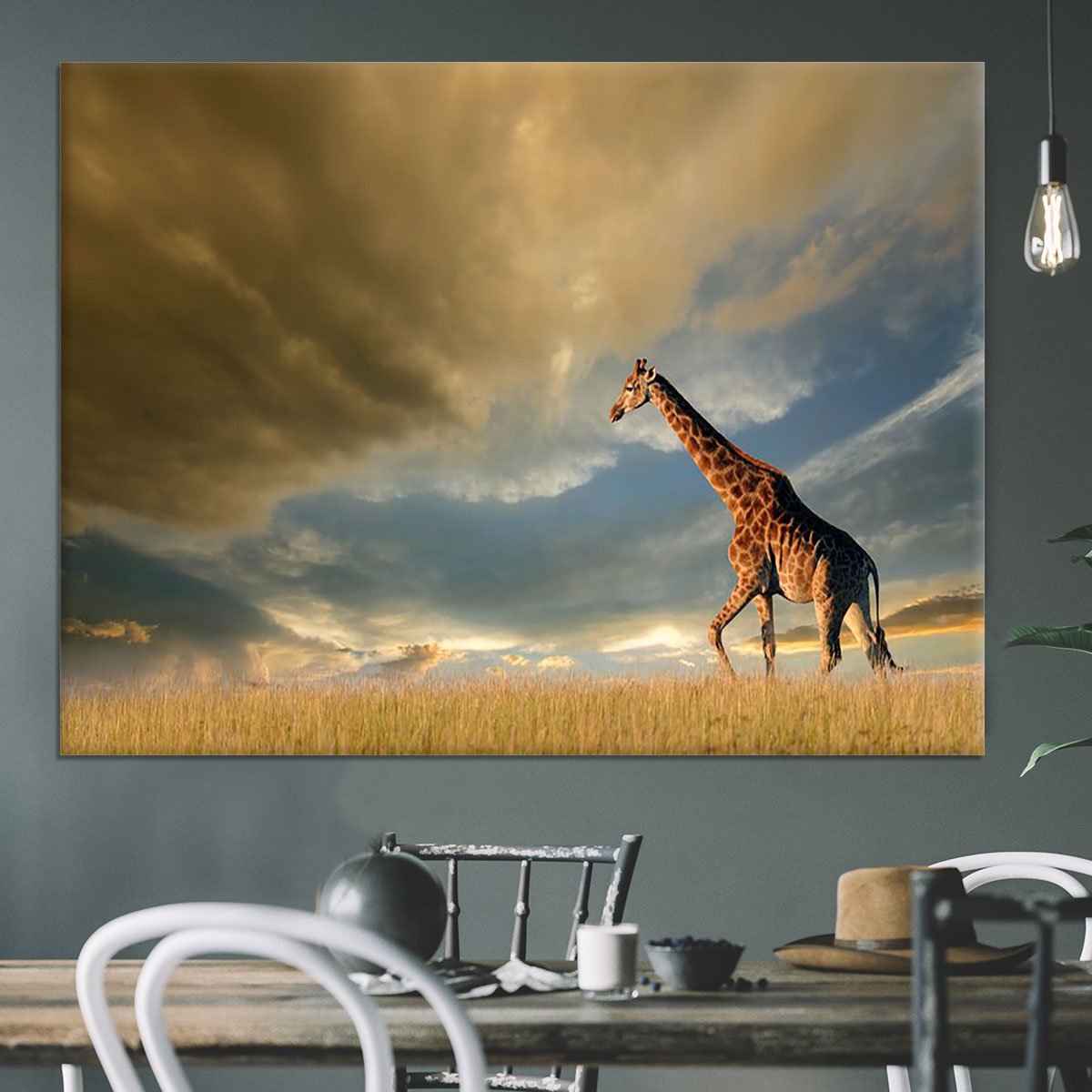 A giraffe walking on the African plains against a dramatic sky Canvas Print or Poster