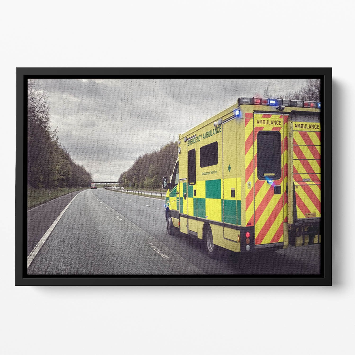 Ambulance responding to an emergency Floating Framed Canvas