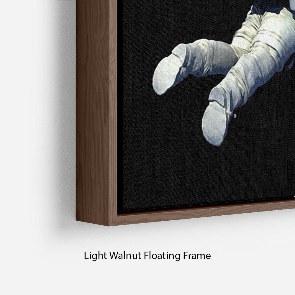 Astronaut Floating to Earth Floating Framed Canvas