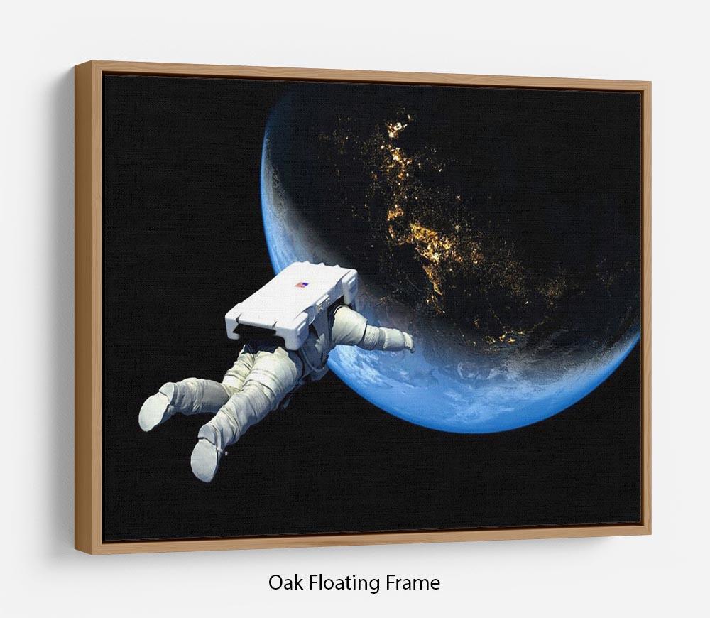 Astronaut Floating to Earth Floating Framed Canvas