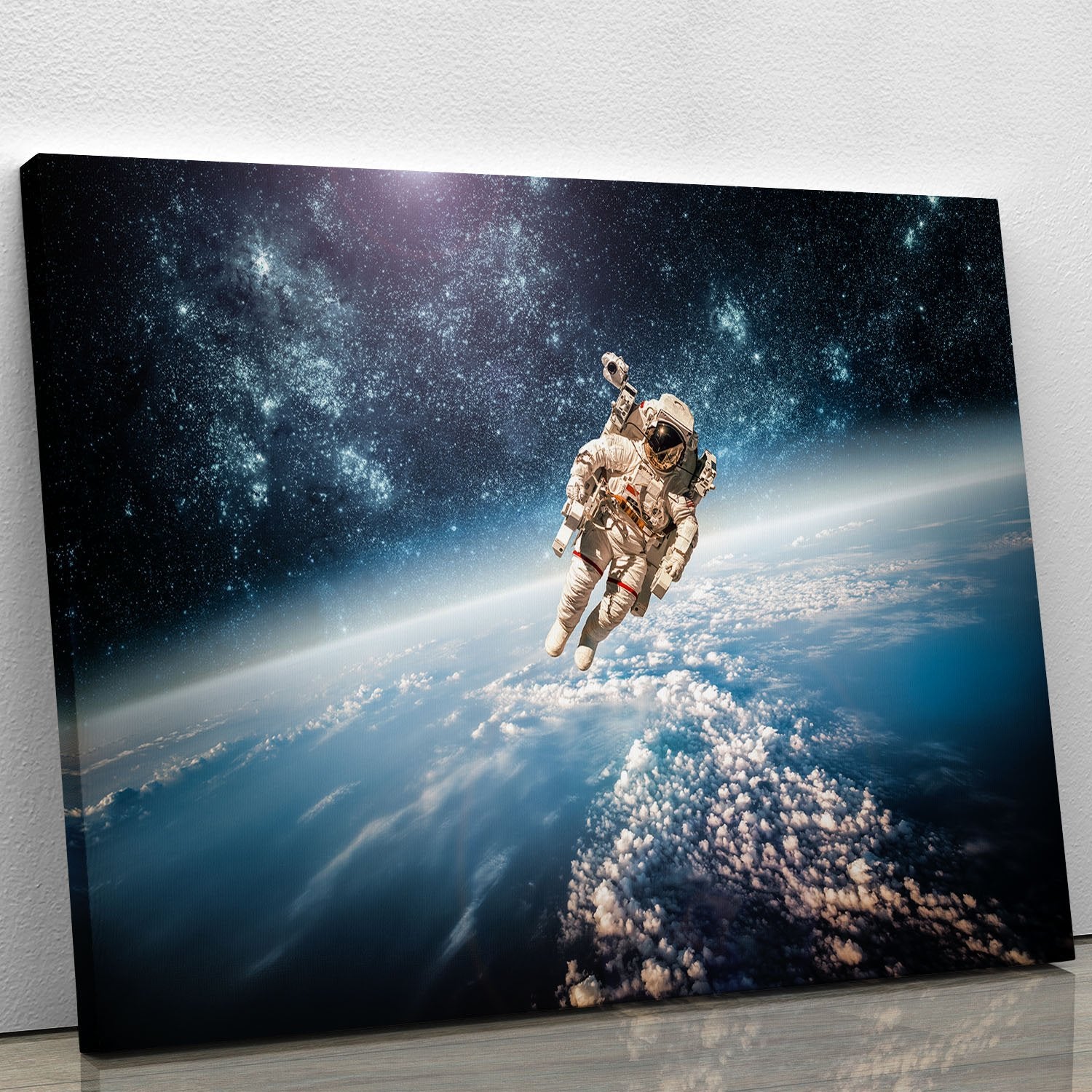 Astronaut in outer space planet earth Canvas Print or Poster