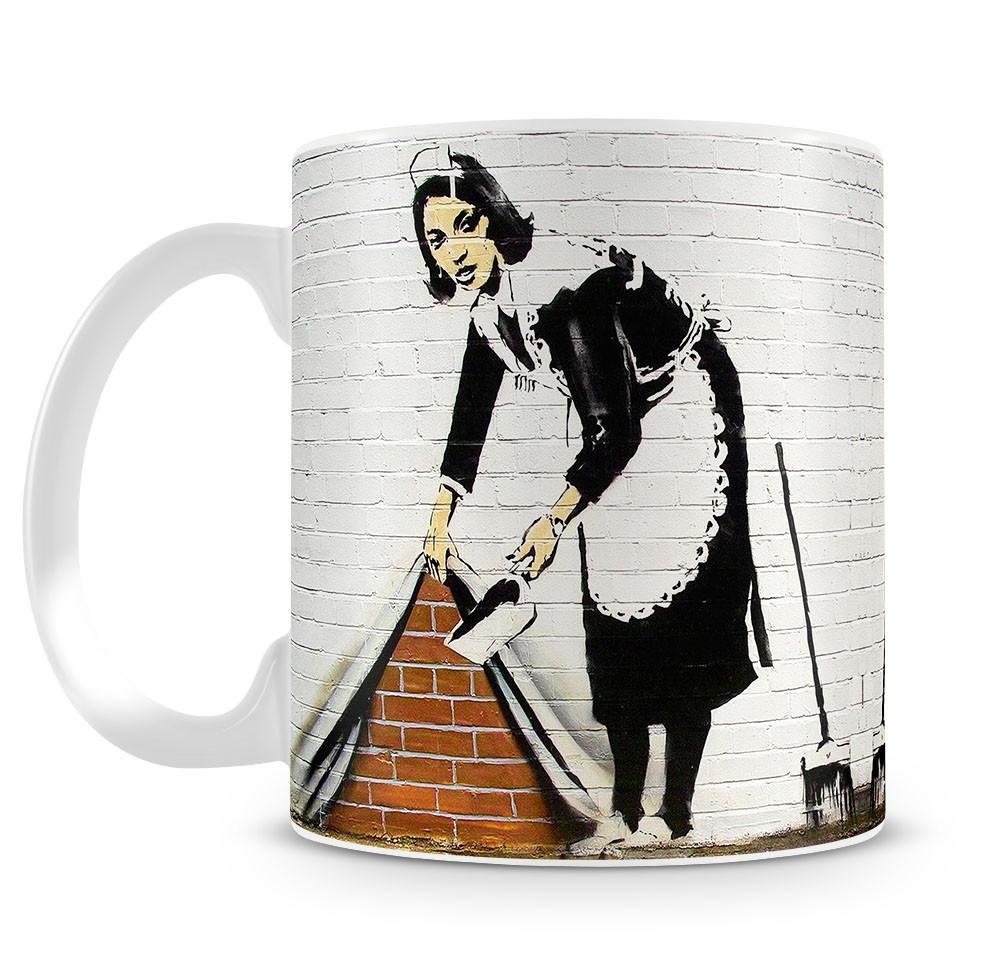 Banksy Maid Sweeping Under the Carpet Mug - Canvas Art Rocks