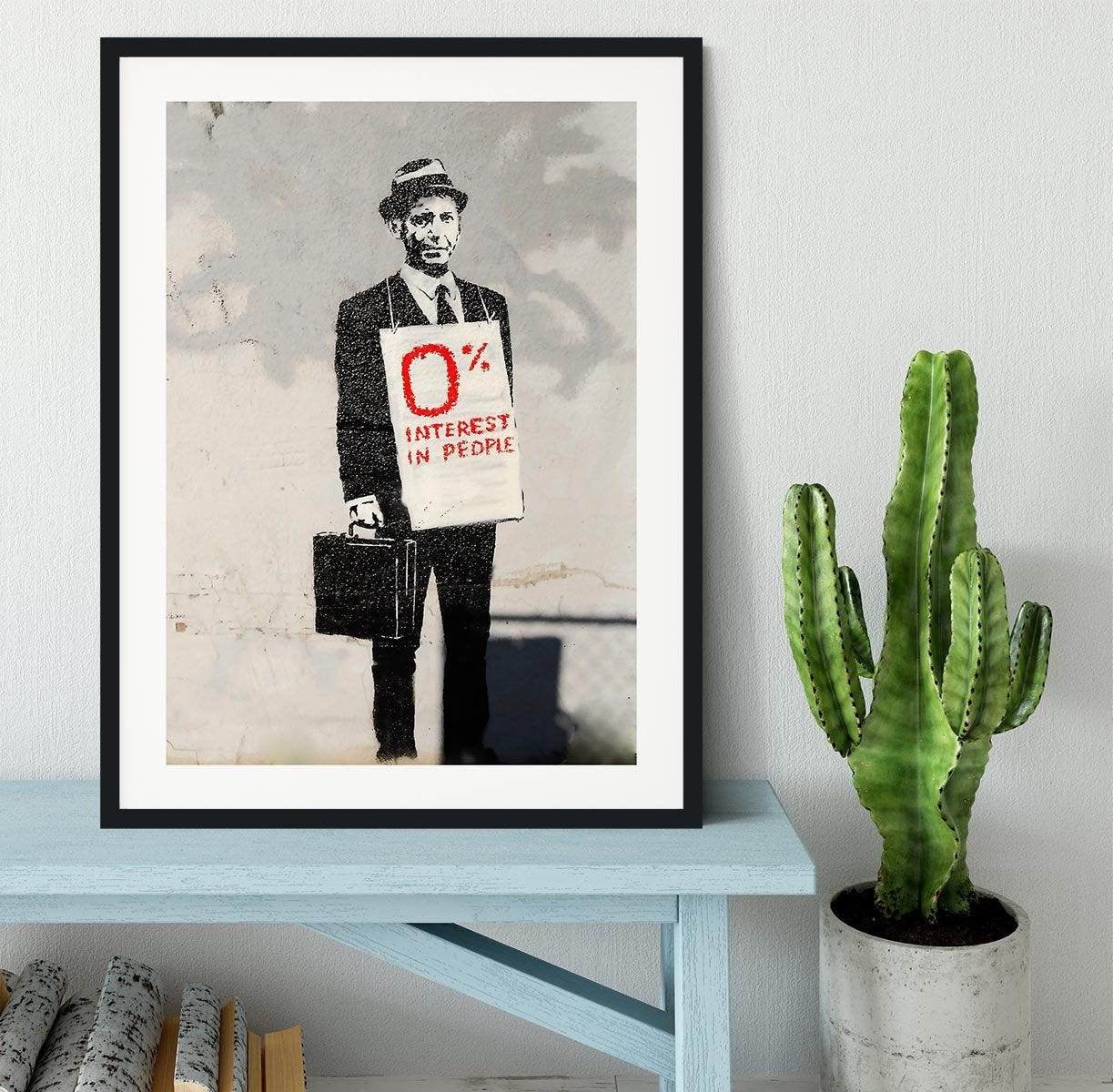 Banksy Zero Per Cent Interest in People Framed Print