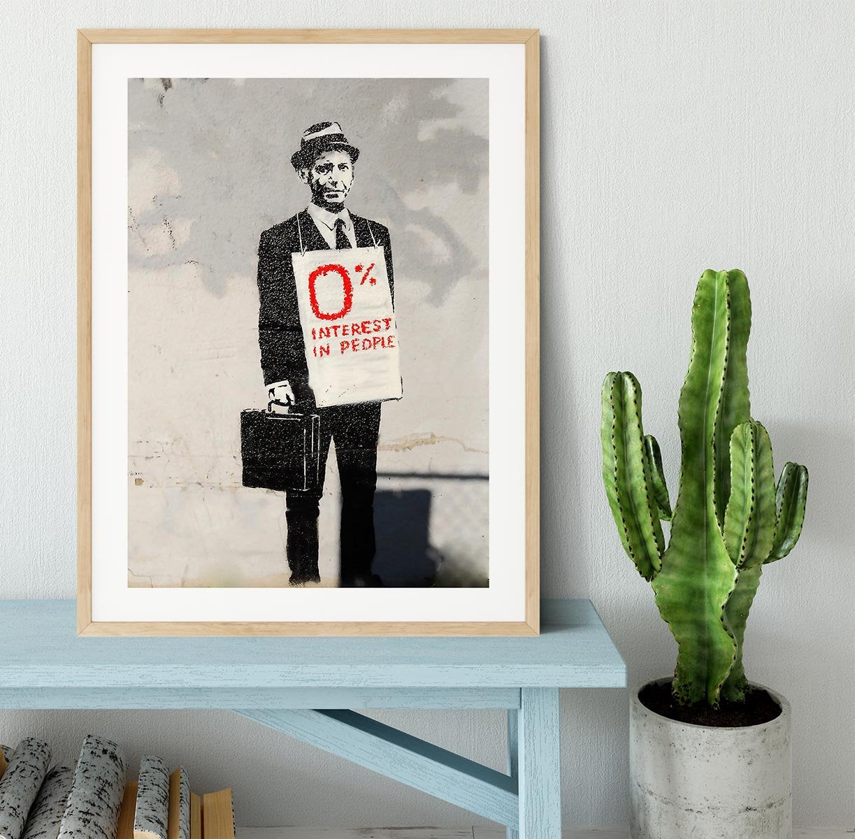 Banksy Zero Per Cent Interest in People Framed Print