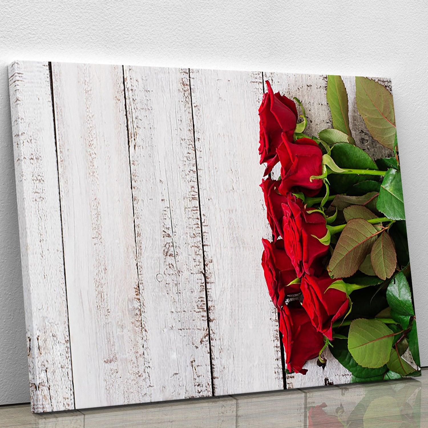 Bouquet of red roses on a light wooden background Canvas Print or Poster