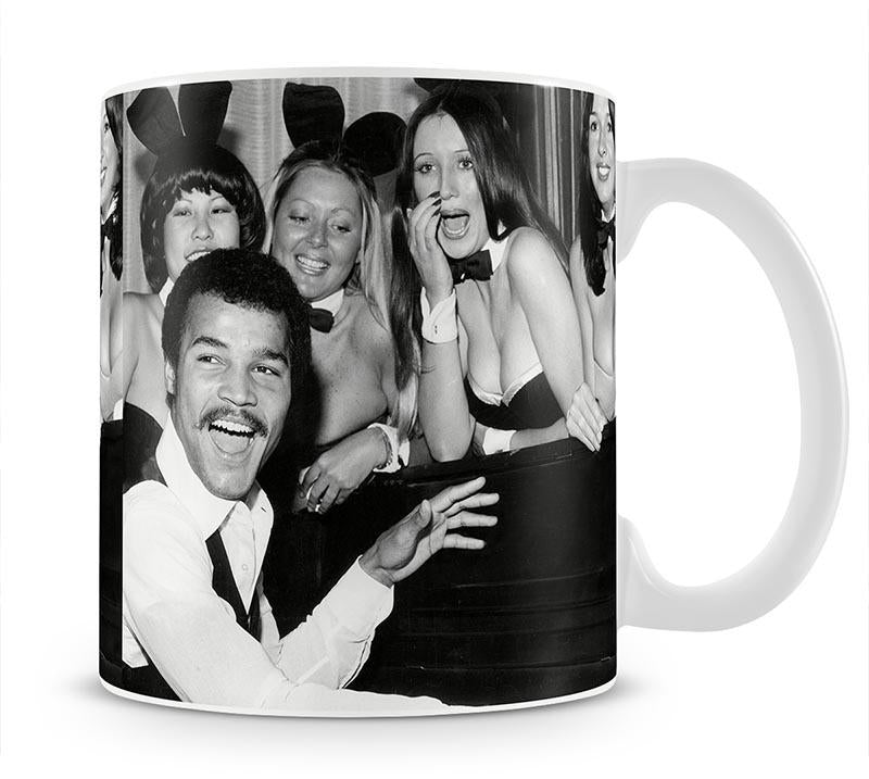 Boxer John Conteh with bunny girls at the playboy club Mug - Canvas Art Rocks - 1