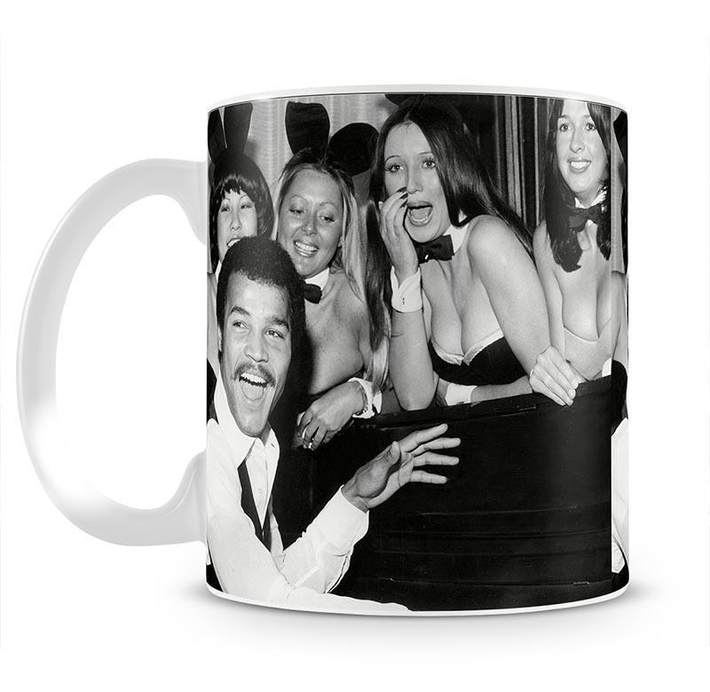 Boxer John Conteh with bunny girls at the playboy club Mug - Canvas Art Rocks - 1