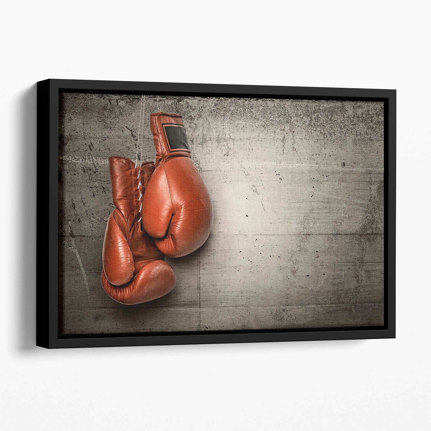 Boxing gloves hanging on concrete Floating Framed Canvas