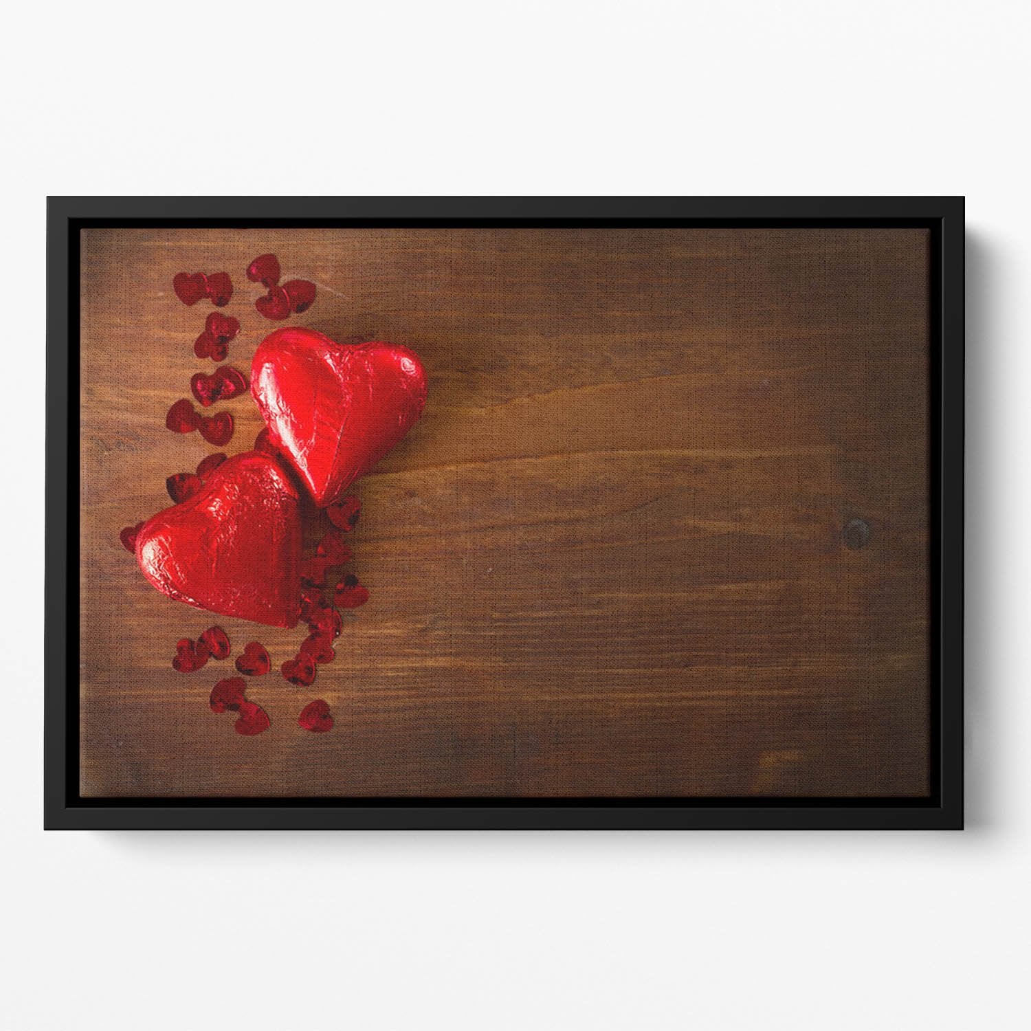 Chocolate hearts on wooden board Floating Framed Canvas