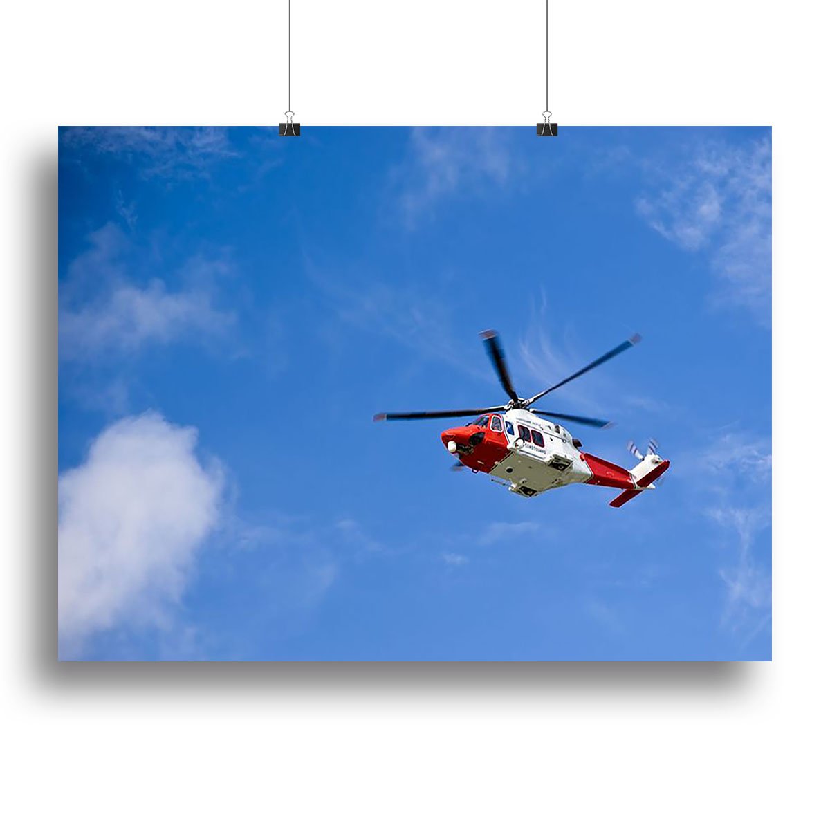 Coastguard helicopter in the blue sky Canvas Print or Poster
