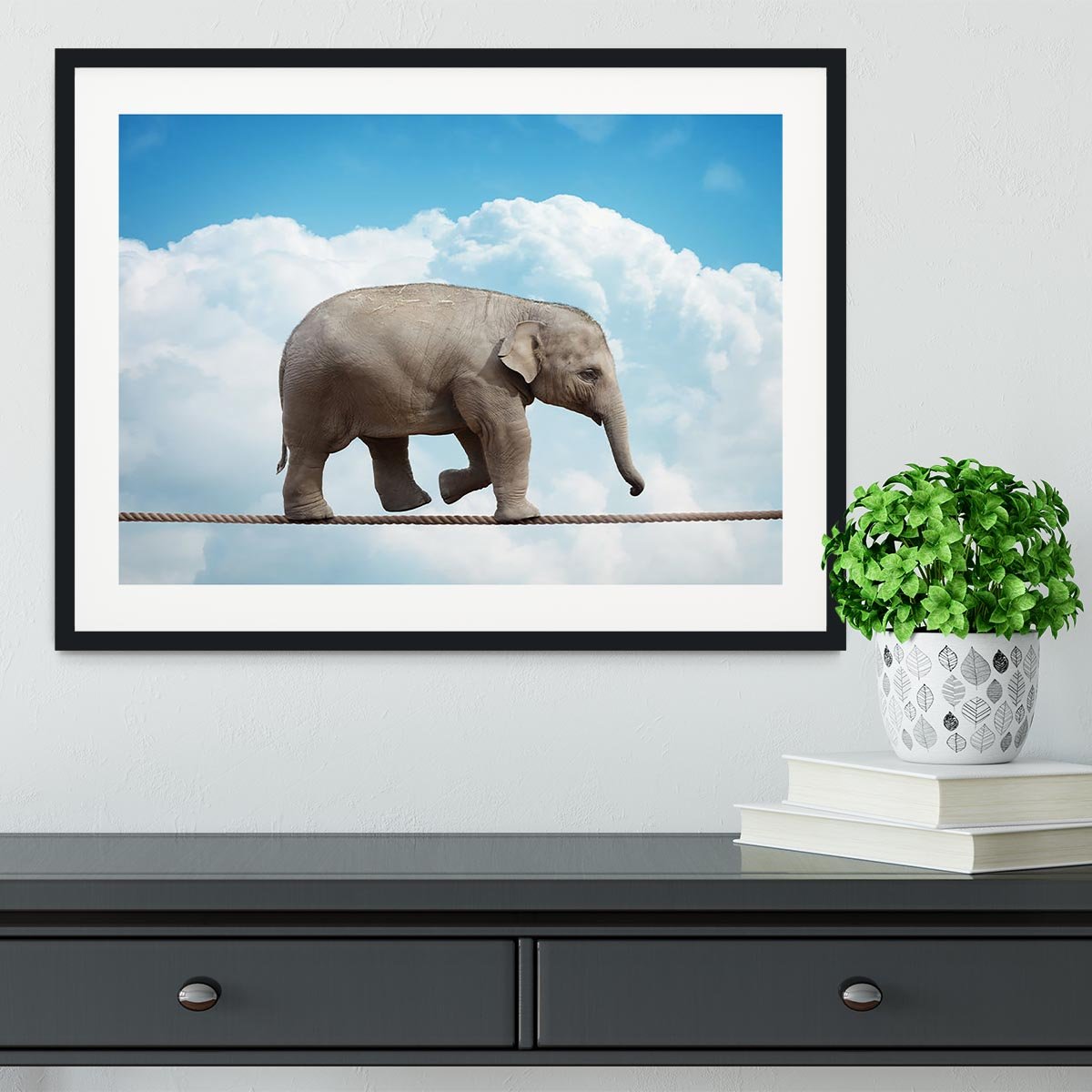 Elehant calf balancing on a tightrope Framed Print - Canvas Art Rocks - 1