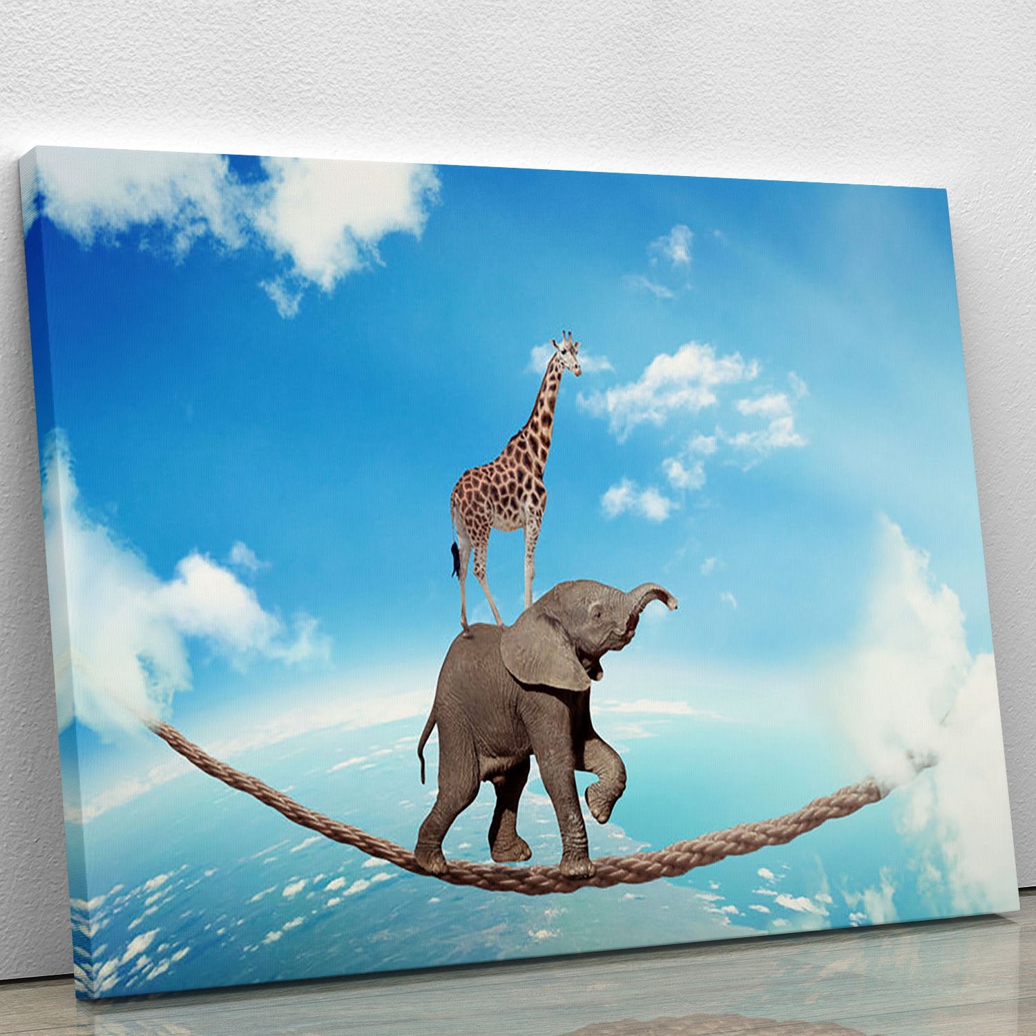 Elephant with giraffe walking on dangerous rope high in sky Canvas Print or Poster