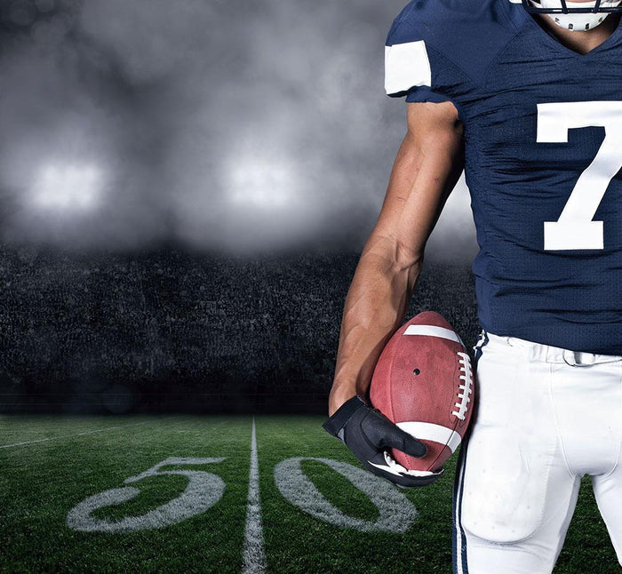 Football Player on at the Stadium Wall Mural Wallpaper