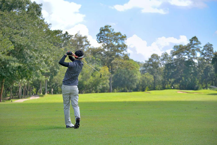 Golf player pitching the golf ball Wall Mural Wallpaper