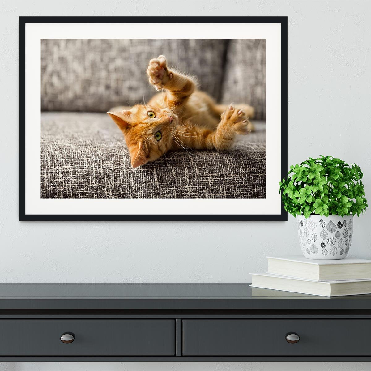 Little cat playing on the bed Framed Print - Canvas Art Rocks - 1