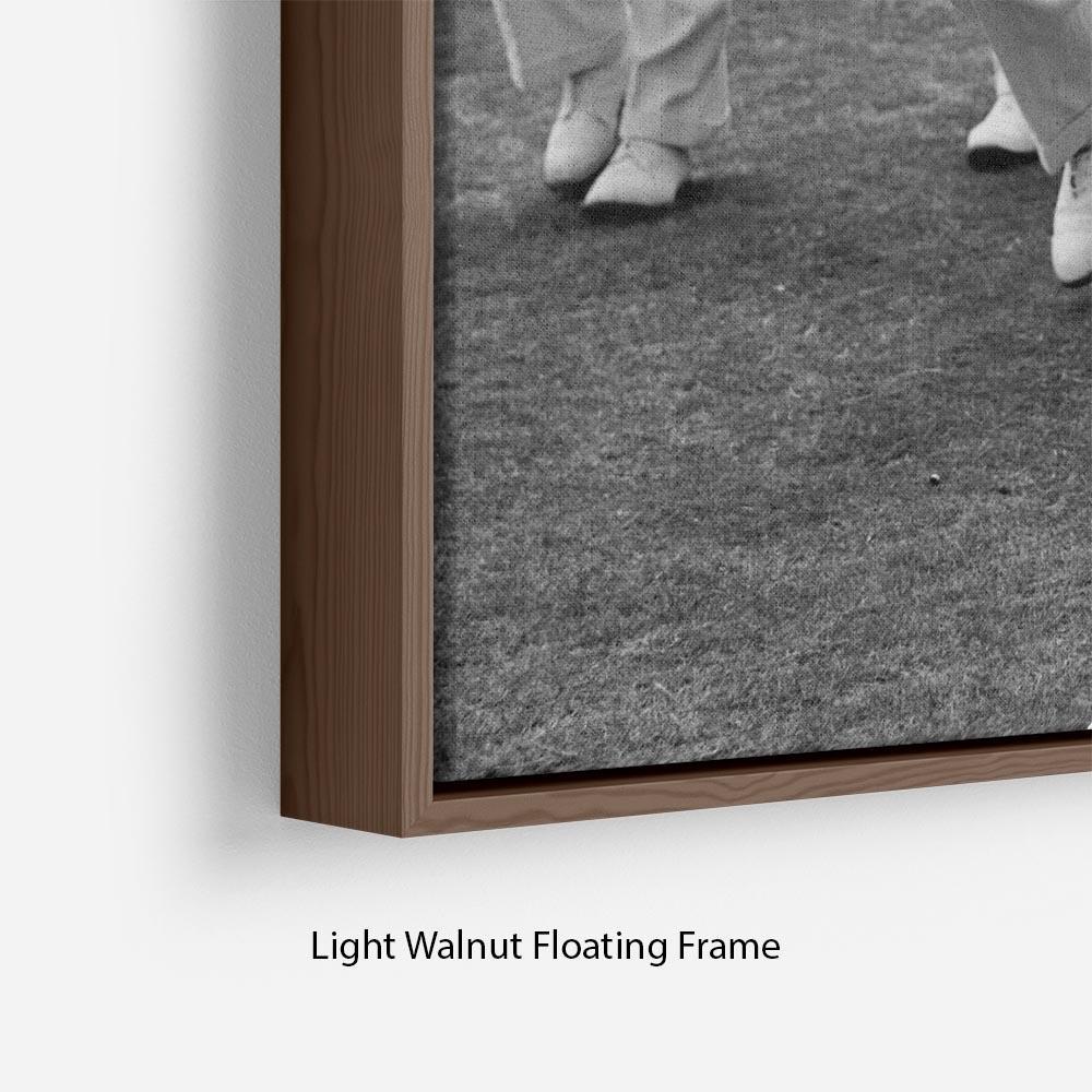 Prince Philip leading his cricket team onto the field Floating Frame Canvas