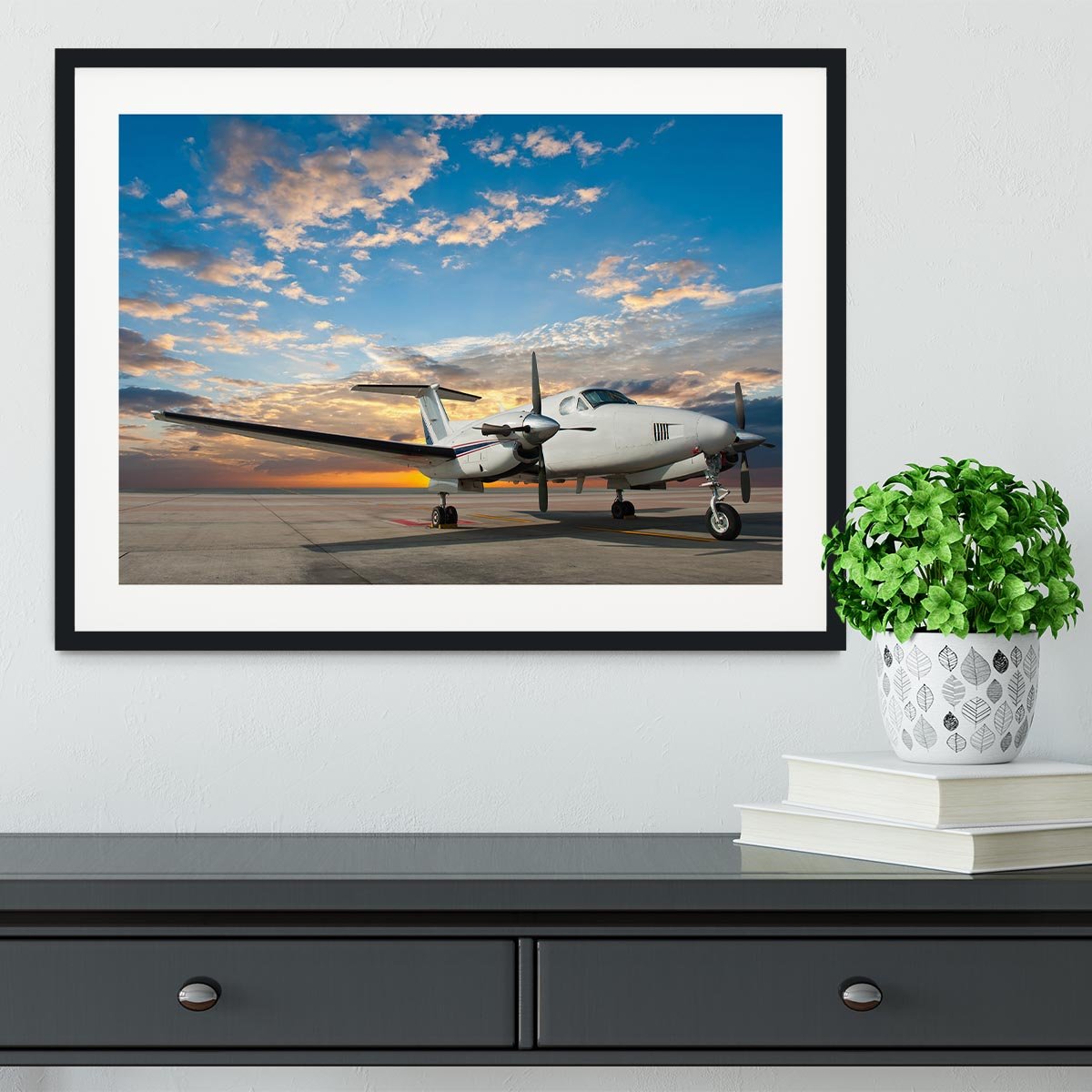 Propeller plane parking at the airport Framed Print - Canvas Art Rocks - 1