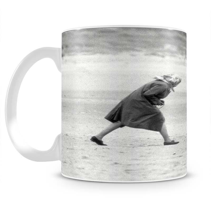 Queen Elizabeth II walking her pet corgis on a Norfolk beach Mug - Canvas Art Rocks - 2