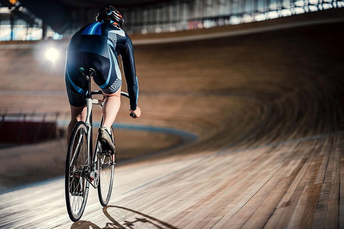 Racing cyclist on velodrome Wall Mural Wallpaper