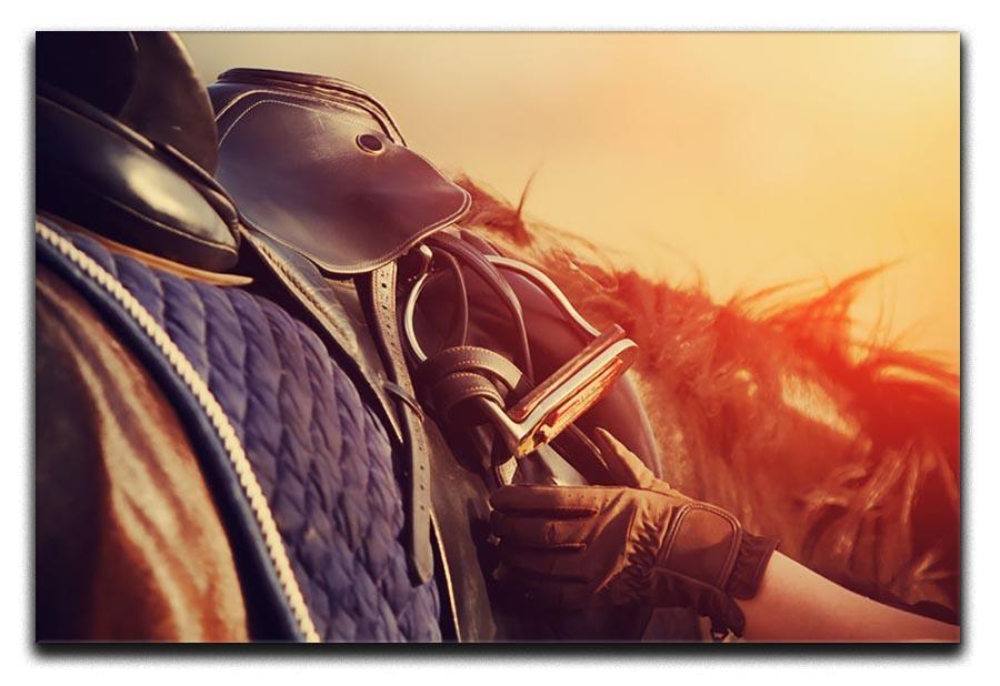 Saddle with stirrups on a back of a horse Canvas Print or Poster - Canvas Art Rocks - 1
