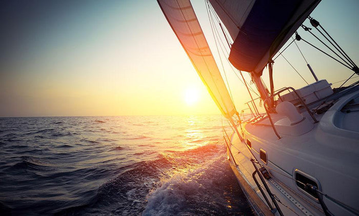 Sail boat gliding Wall Mural Wallpaper