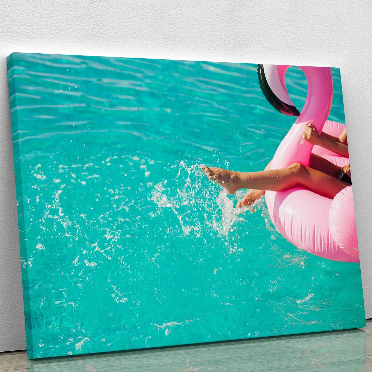 Tan girl sits on inflatable mattress flamingos in the pool Canvas Print or Poster