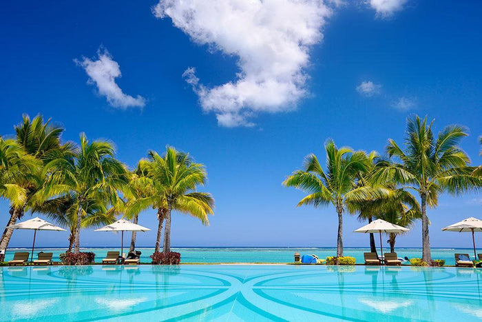 Tropical beach resort with lounge chairs Wall Mural Wallpaper