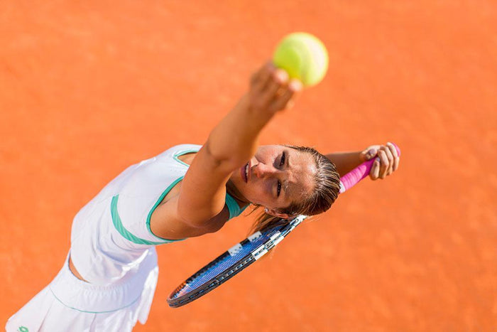 Woman playing tennis Wall Mural Wallpaper