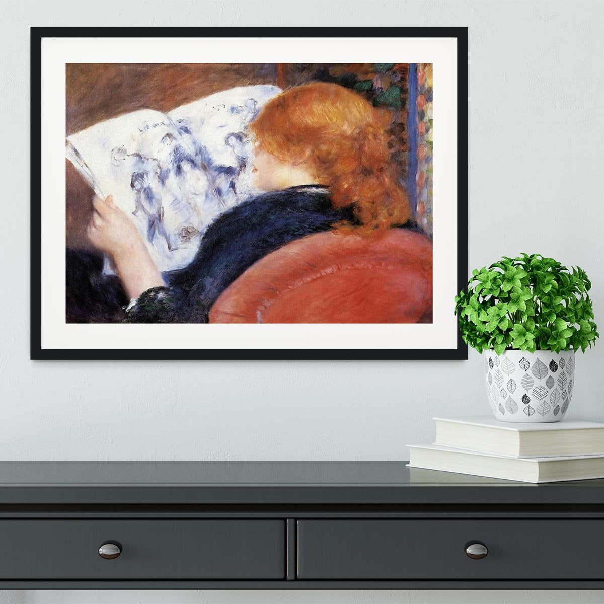 Young woman reads illustrated journal by Renoir Framed Print - Canvas Art Rocks - 1