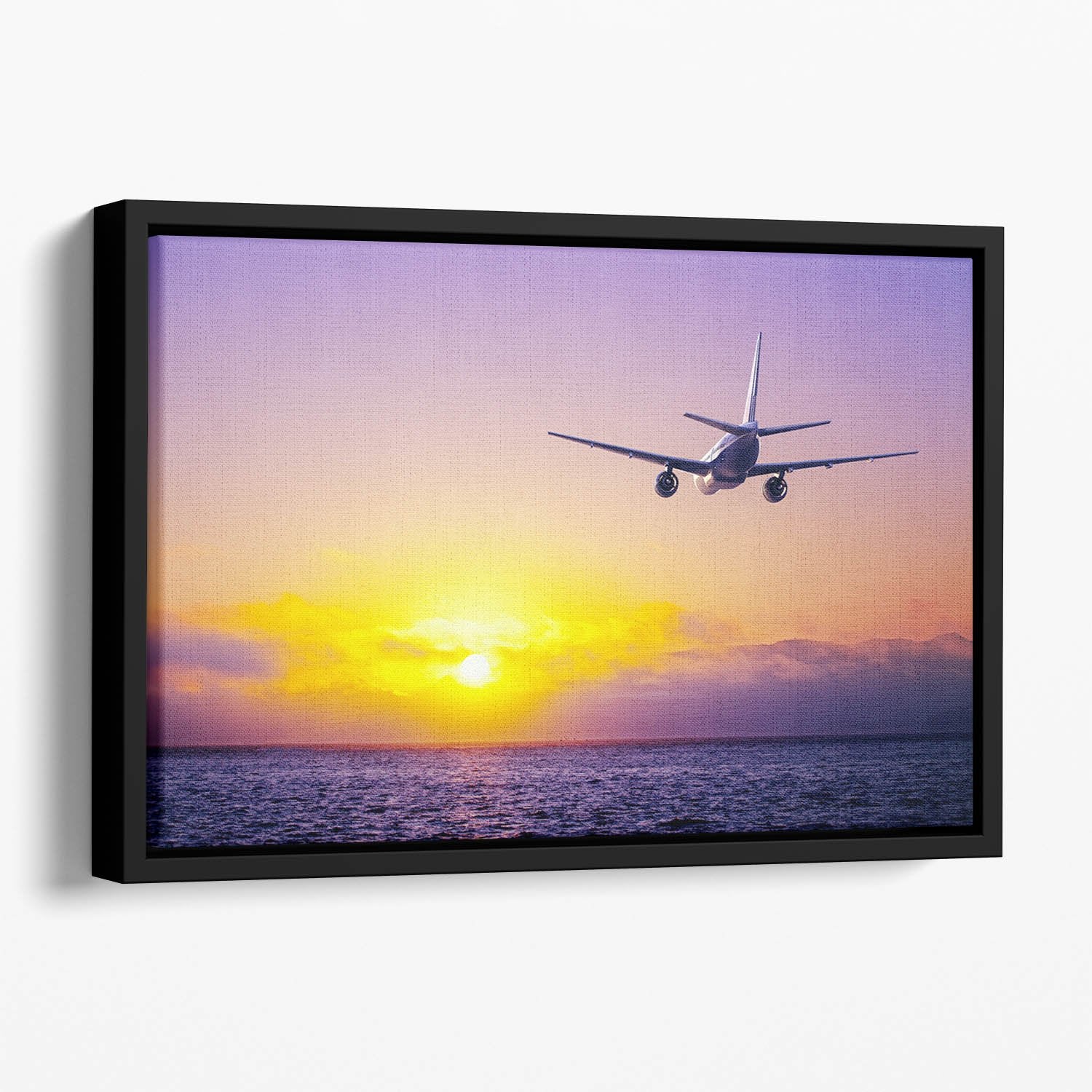 airplane in the sky over ocean Floating Framed Canvas